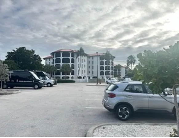 a view of a cars parked in front of a house