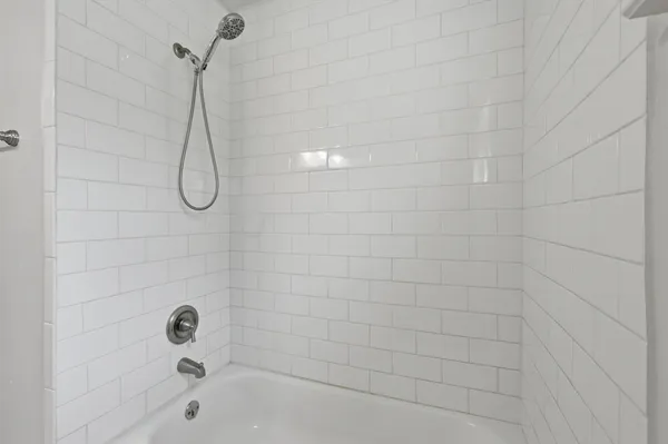 a bathroom with a granite countertop sink a toilet and a mirror