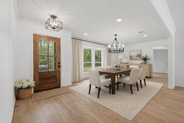 a view of a dining room with furniture window and wooden floor