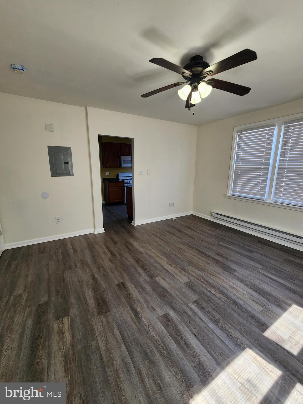 89 Sparks Street Philadelphia, PA 19120 - Photo 12 of 37 wooden floor in an empty room with a window