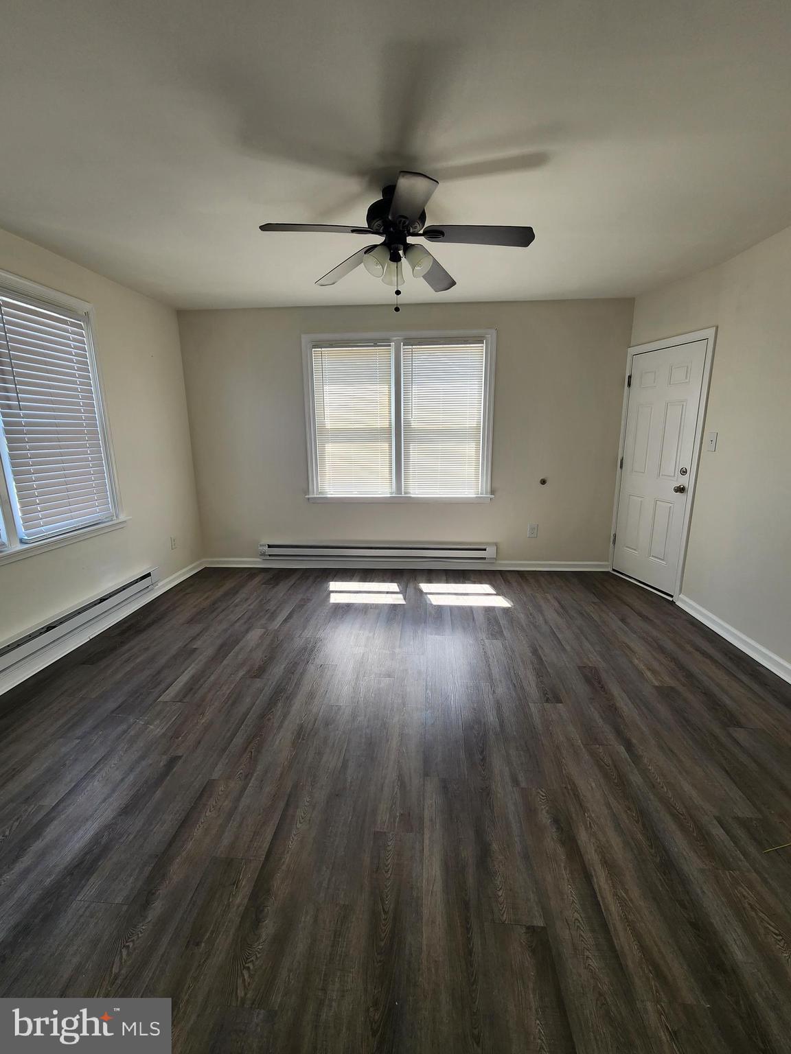 89 Sparks Street Philadelphia, PA 19120 - Photo 13 of 37 wooden floor in an empty room with a window