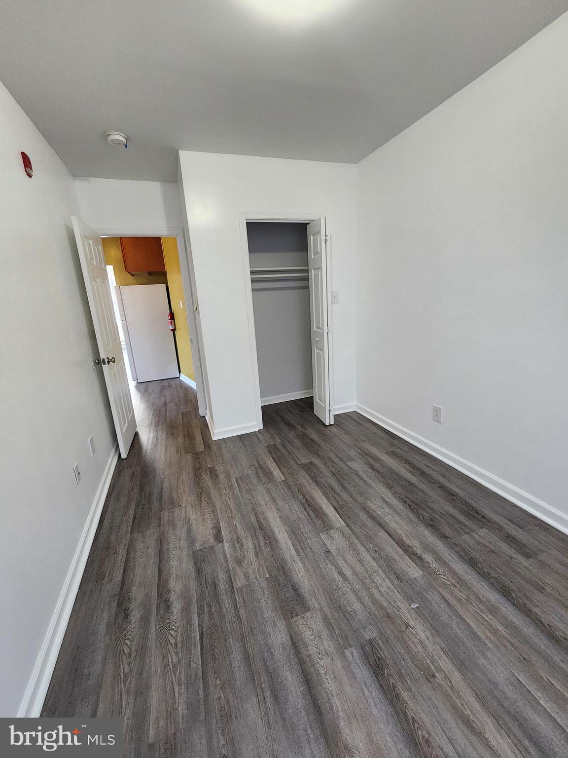 89 Sparks Street Philadelphia, PA 19120 - Photo 20 of 37 wooden floor in an empty room with a window