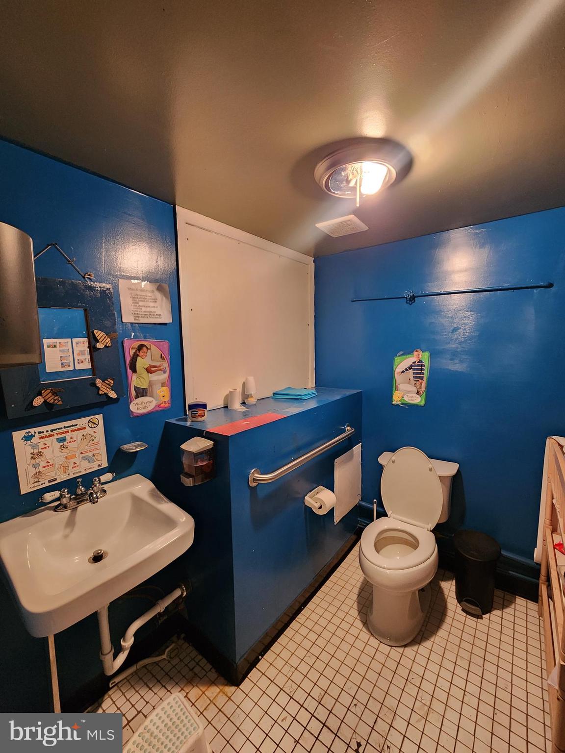89 Sparks Street Philadelphia, PA 19120 - Photo 30 of 37 a bathroom with a sink toilet and a mirror