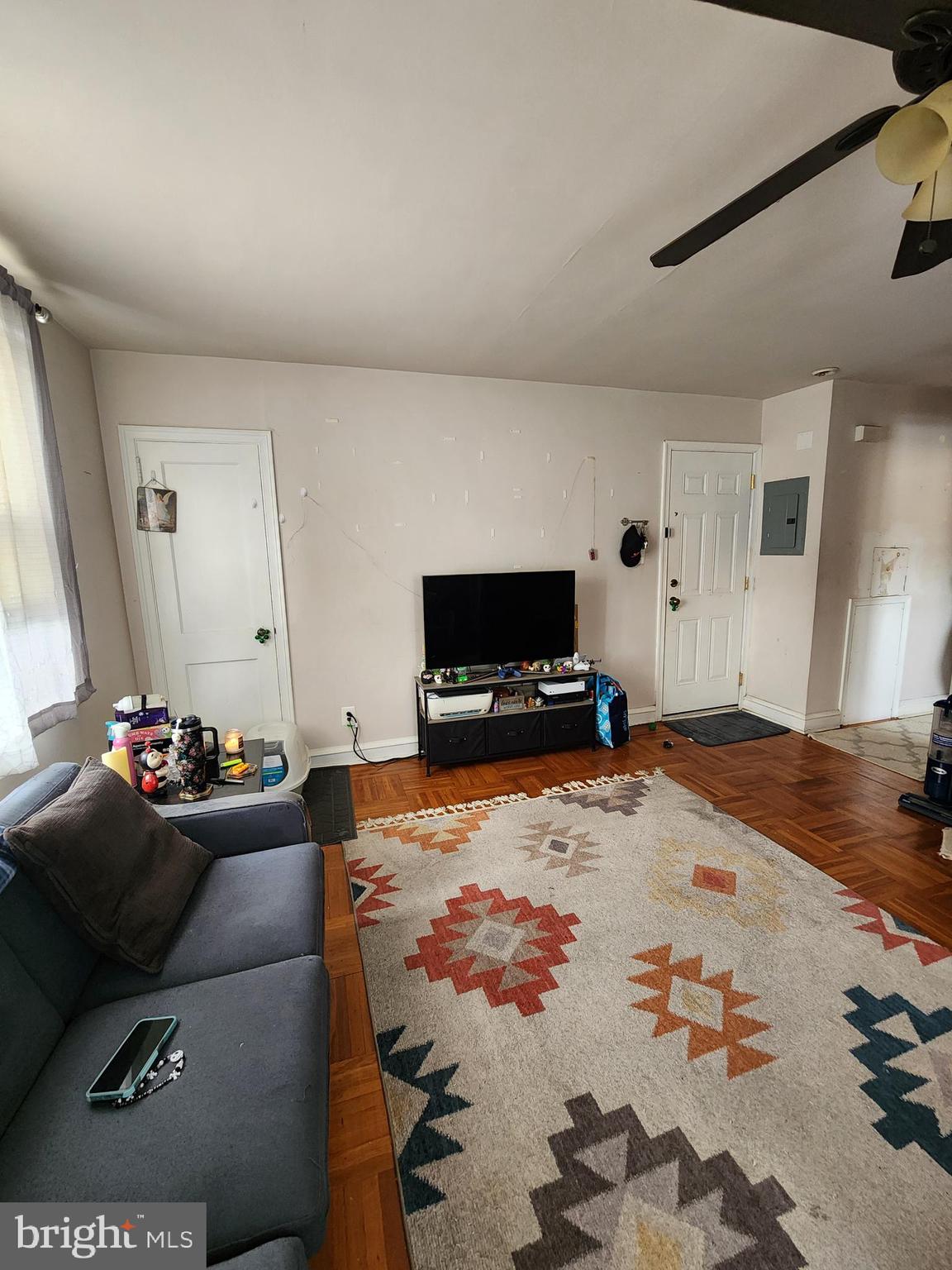 89 Sparks Street Philadelphia, PA 19120 - Photo 4 of 37 a living room with furniture and a flat screen tv