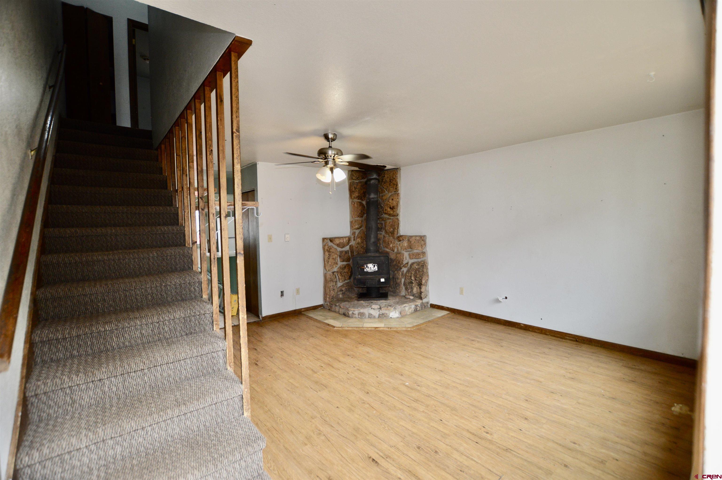 1005 West Denver Avenue, Unit G4 Gunnison, CO 81230 - Photo 13 of 21 a view of a room with stairs and a living room