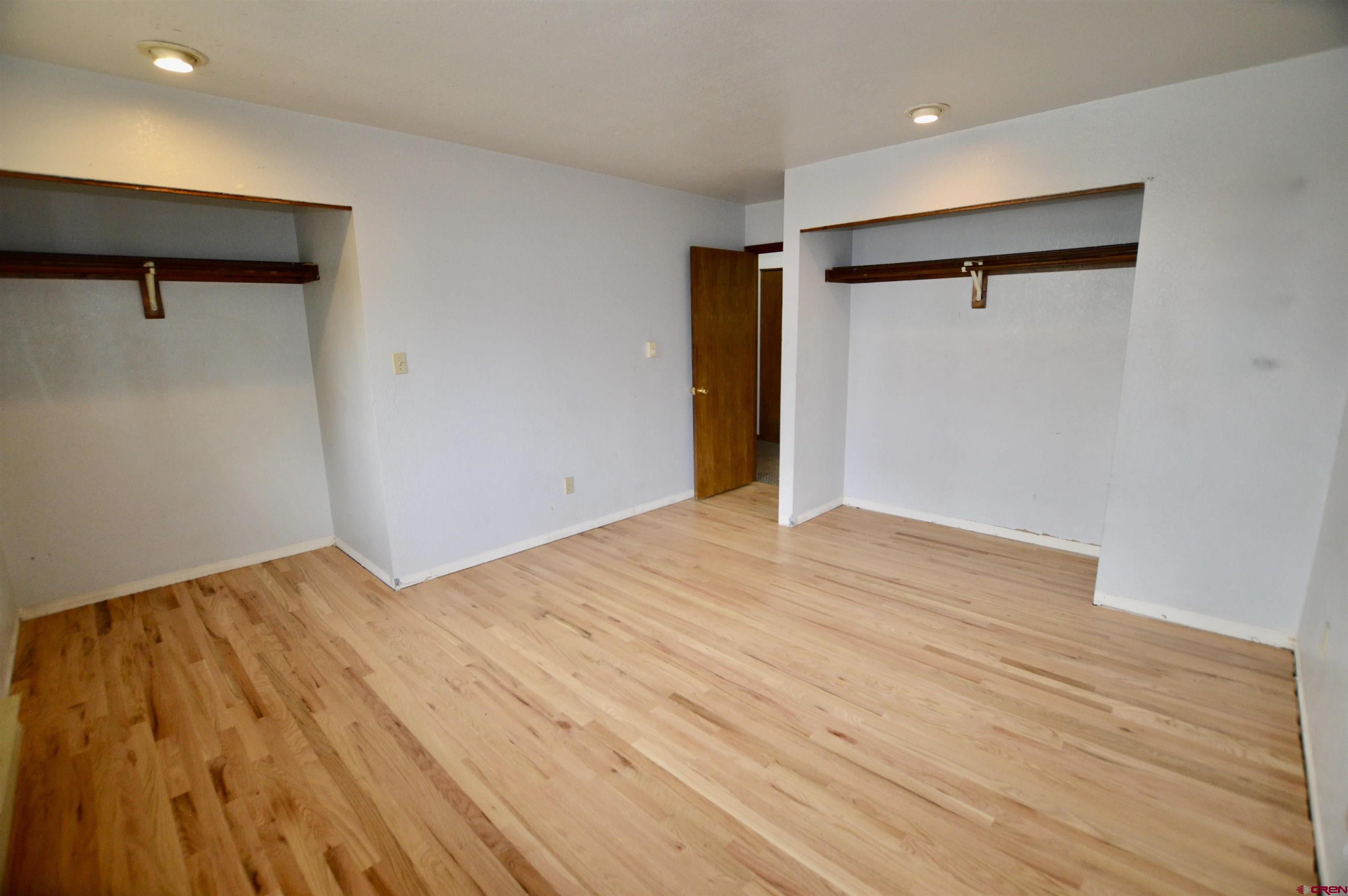 1005 West Denver Avenue, Unit G4 Gunnison, CO 81230 - Photo 17 of 21 a view of empty room with wooden floor and fan