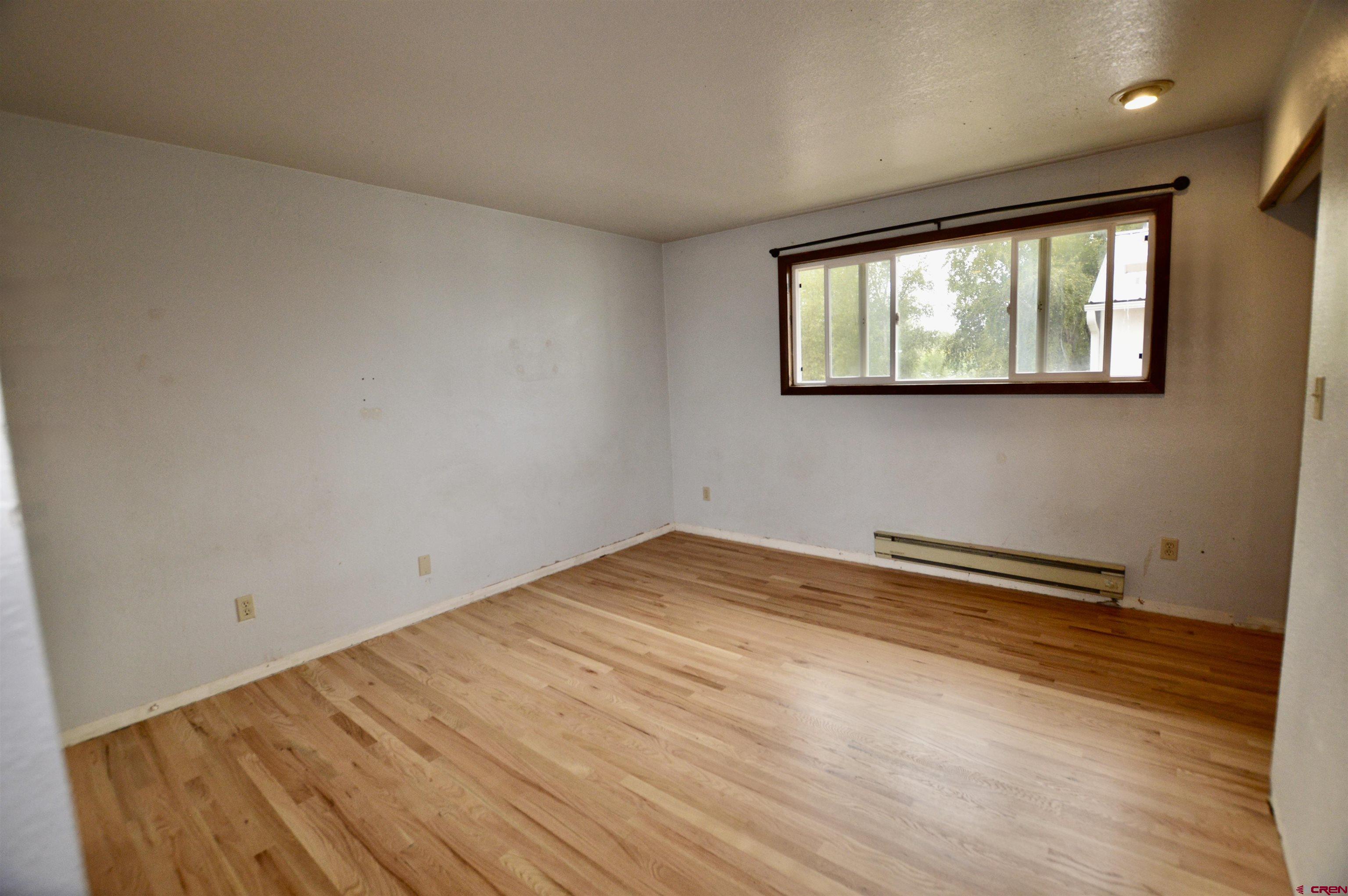 1005 West Denver Avenue, Unit G4 Gunnison, CO 81230 - Photo 18 of 21 a view of empty room with wooden floor