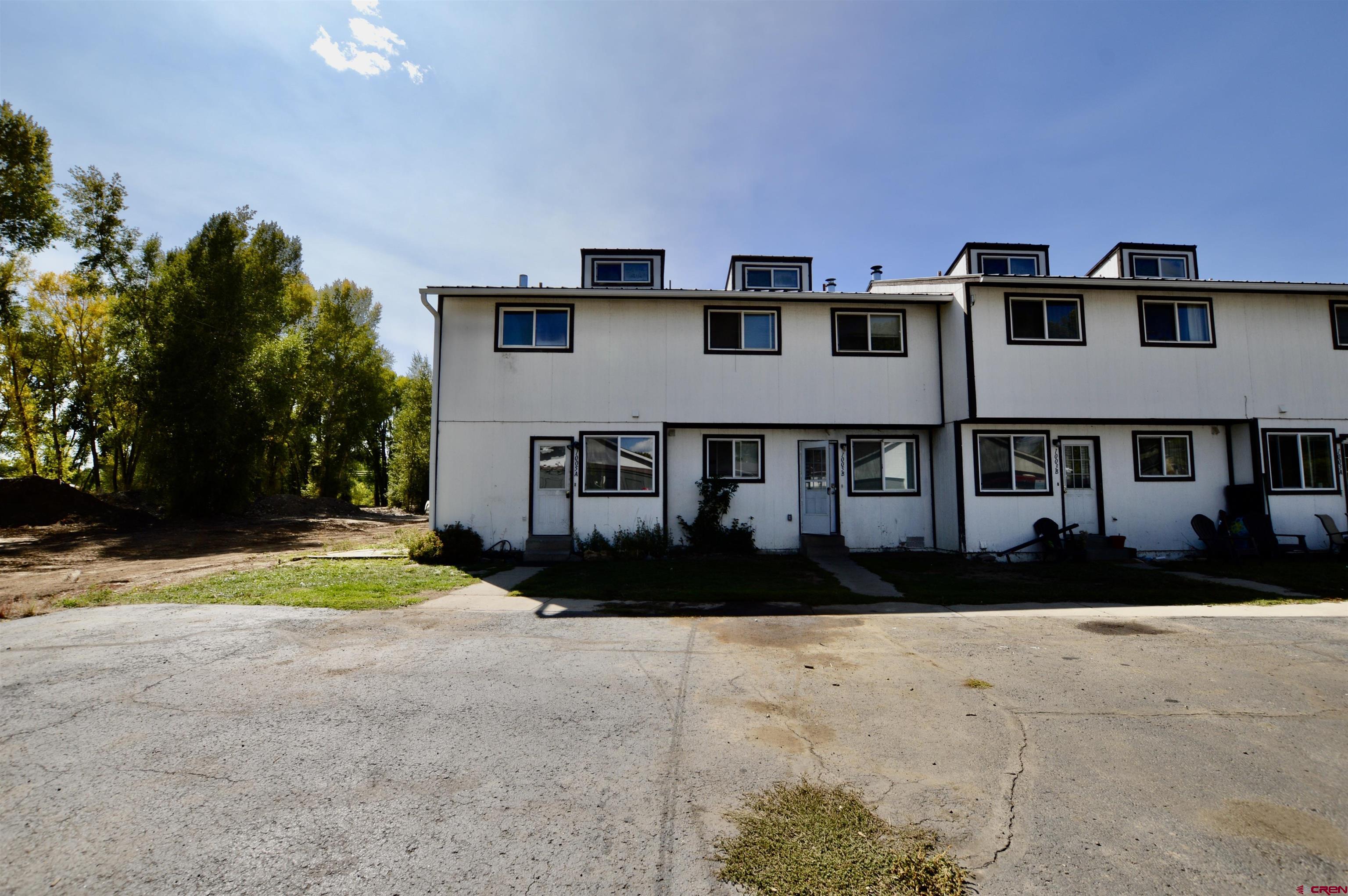 1005 West Denver Avenue, Unit G4 Gunnison, CO 81230 - Photo 2 of 21 a view of swimming pool with outdoor seating