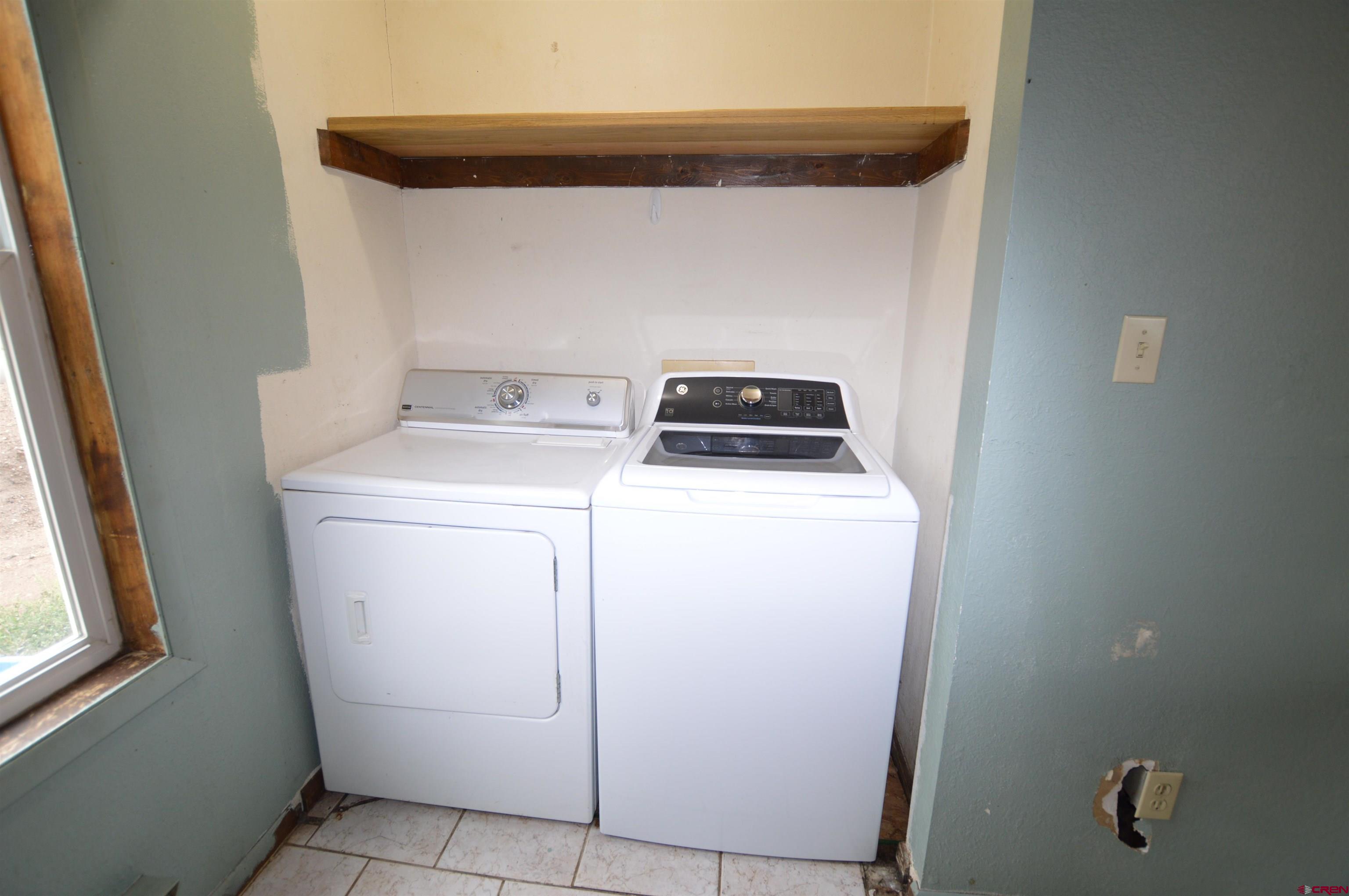 1005 West Denver Avenue, Unit G4 Gunnison, CO 81230 - Photo 8 of 21 a utility room with dryer and washer