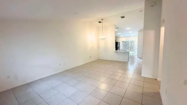 a view of a hallway with a bathroom