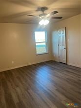 1102 Zora Drive, Unit A & B Temple, TX 76504 - Photo 15 of 30 an empty room with wooden floor and windows