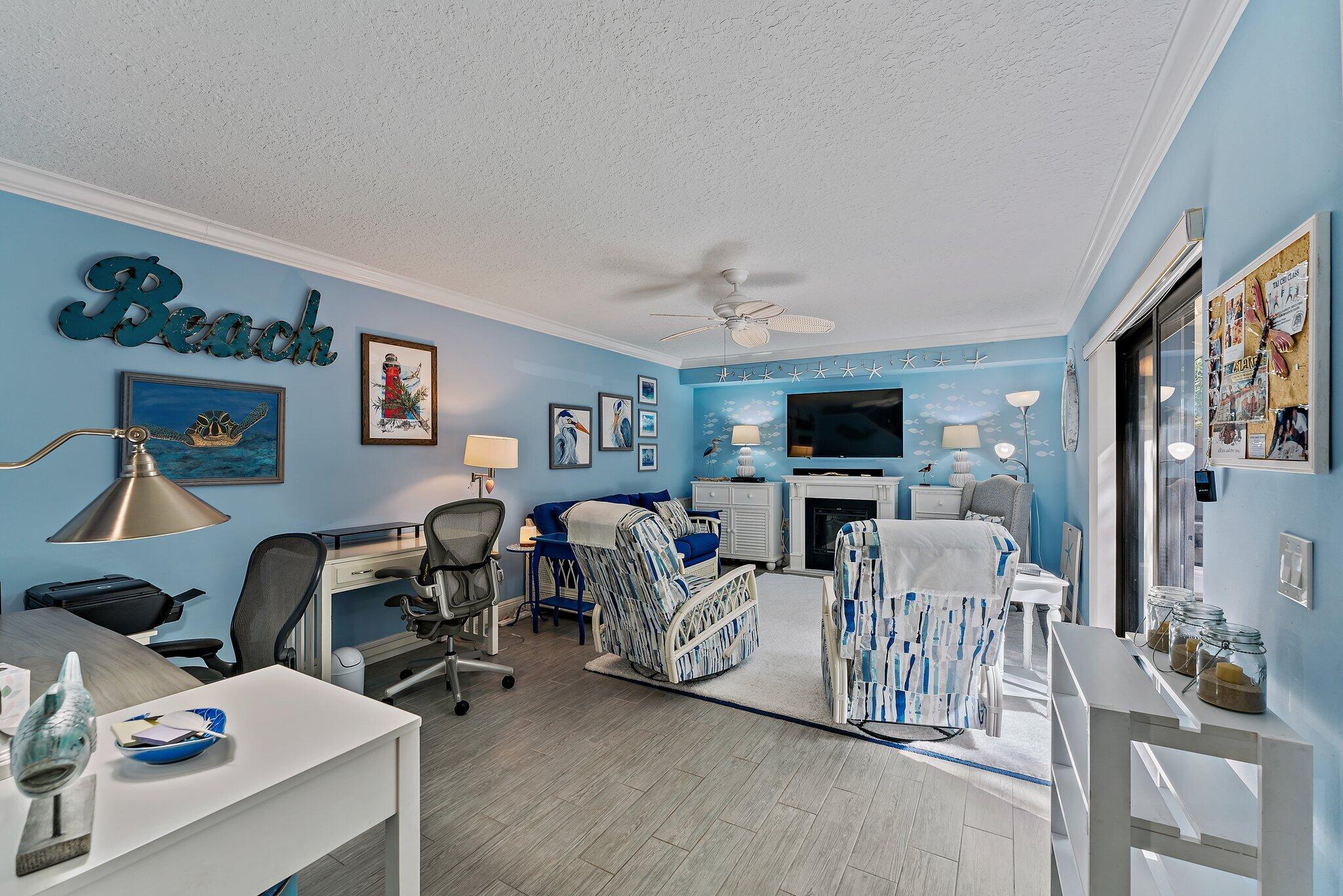 2403 24th Court Jupiter, FL 33477 - Photo 13 of 29 a living room with furniture and a flat screen tv