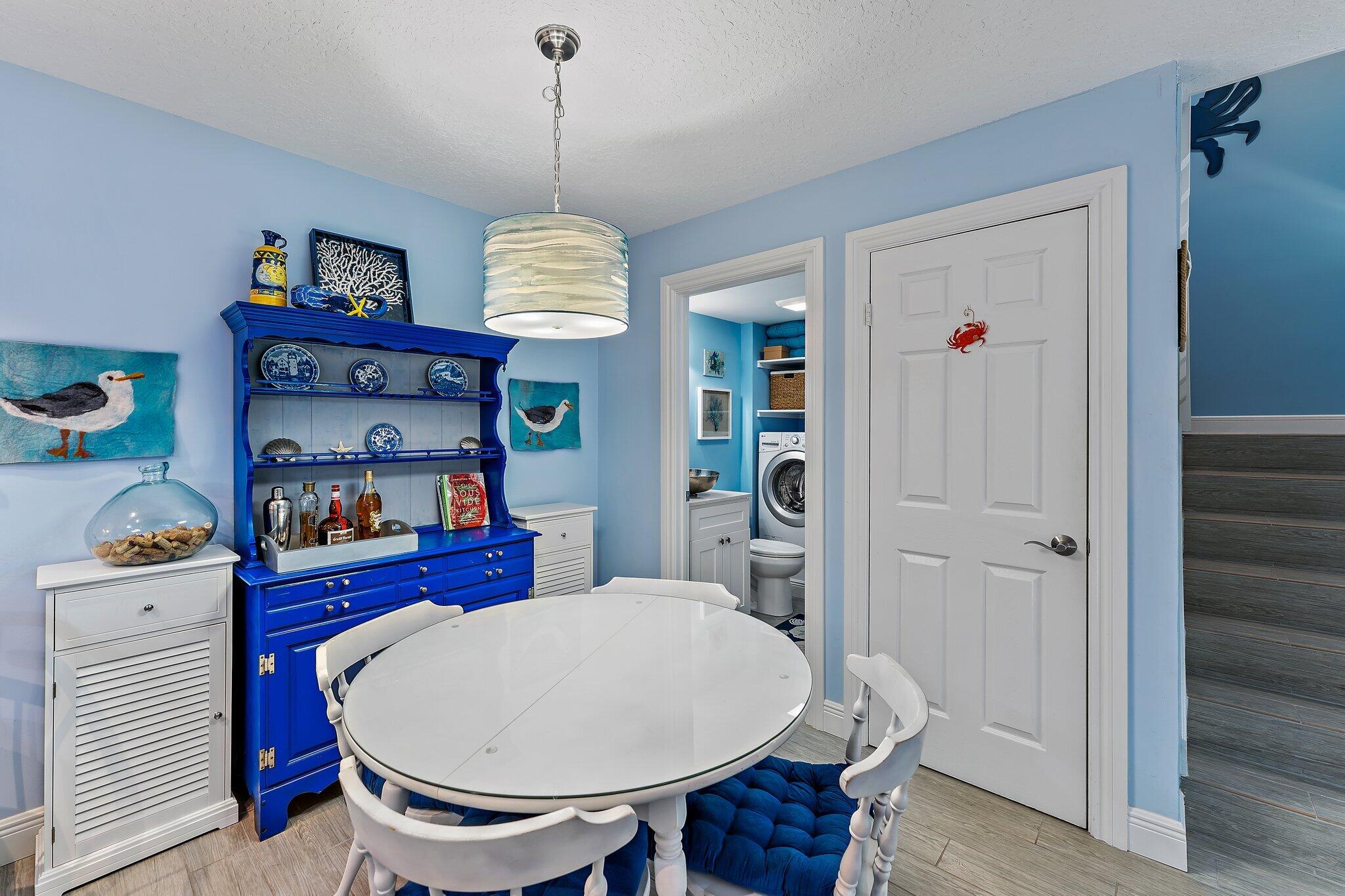 2403 24th Court Jupiter, FL 33477 - Photo 16 of 29 a very nice looking dining room with a table and chairs