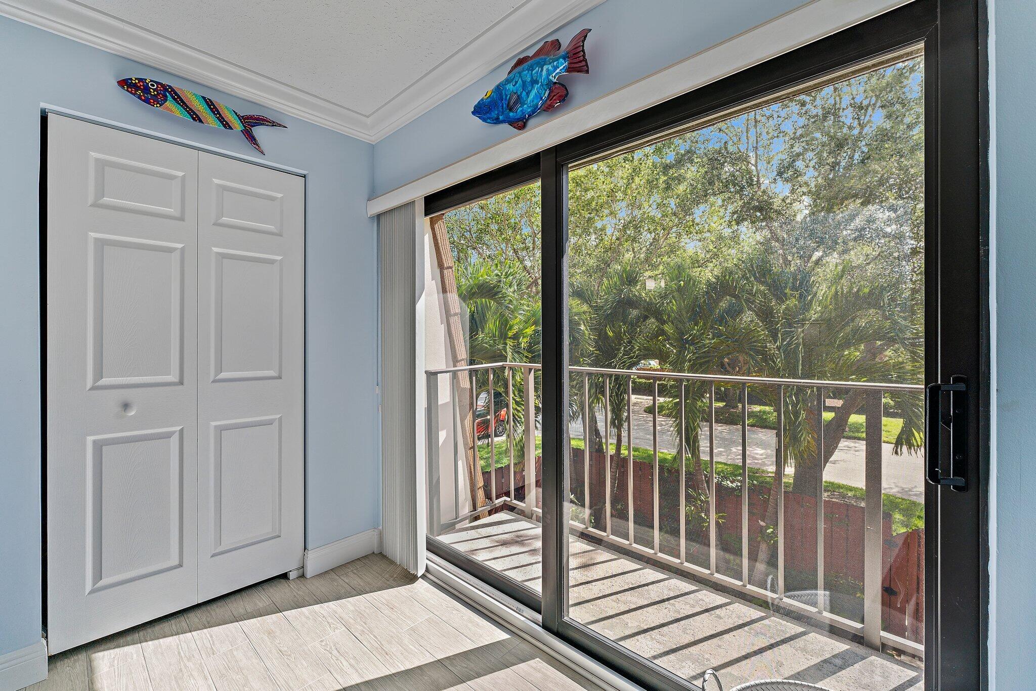 2403 24th Court Jupiter, FL 33477 - Photo 21 of 29 a view of a balcony with wooden floor