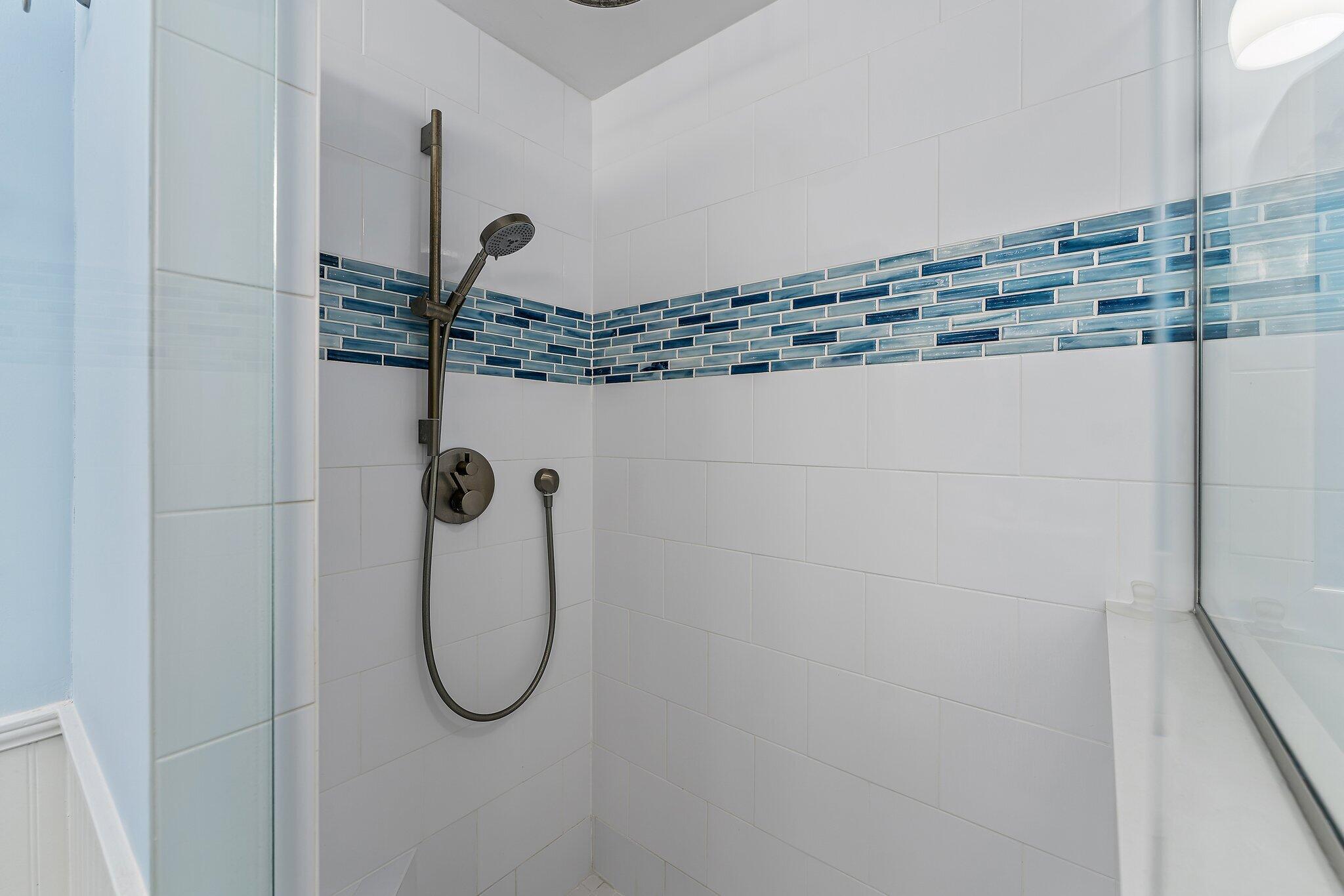 2403 24th Court Jupiter, FL 33477 - Photo 23 of 29 a bathroom with a granite countertop mirror and a sink