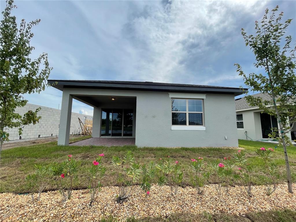 3434 Sagebrush Street Harmony, FL 34773 - Photo 13 of 21 a house with garden in front of it