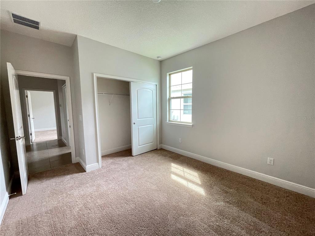 3434 Sagebrush Street Harmony, FL 34773 - Photo 6 of 21 an empty room with windows