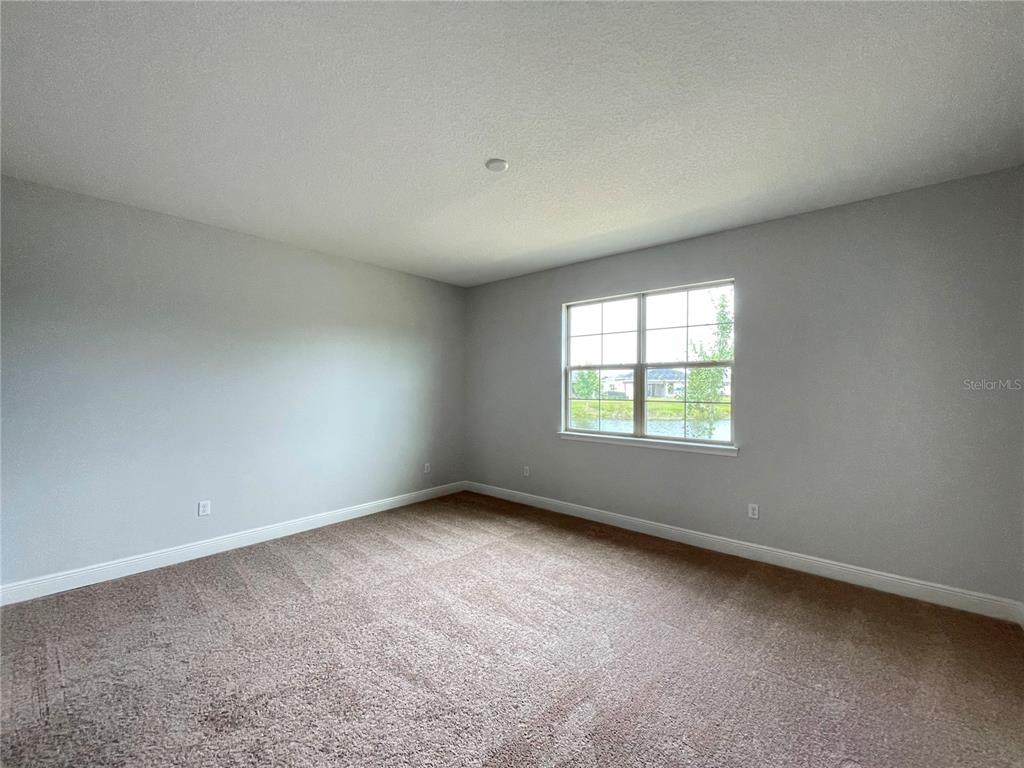 3434 Sagebrush Street Harmony, FL 34773 - Photo 7 of 21 an empty room with a window