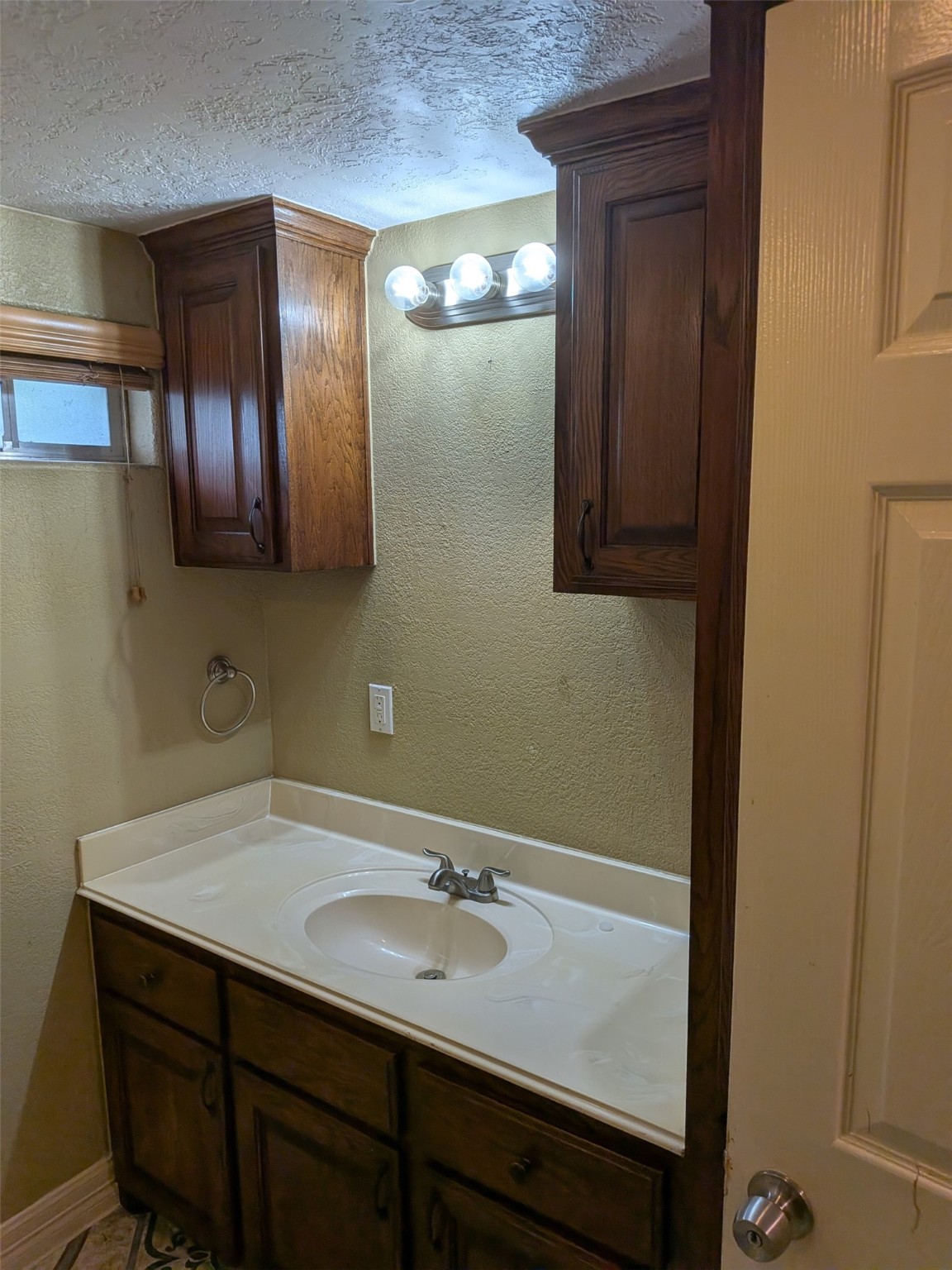 807 Ruth Street Baytown, TX 77520 - Photo 16 of 36 a bathroom with a sink and a mirror