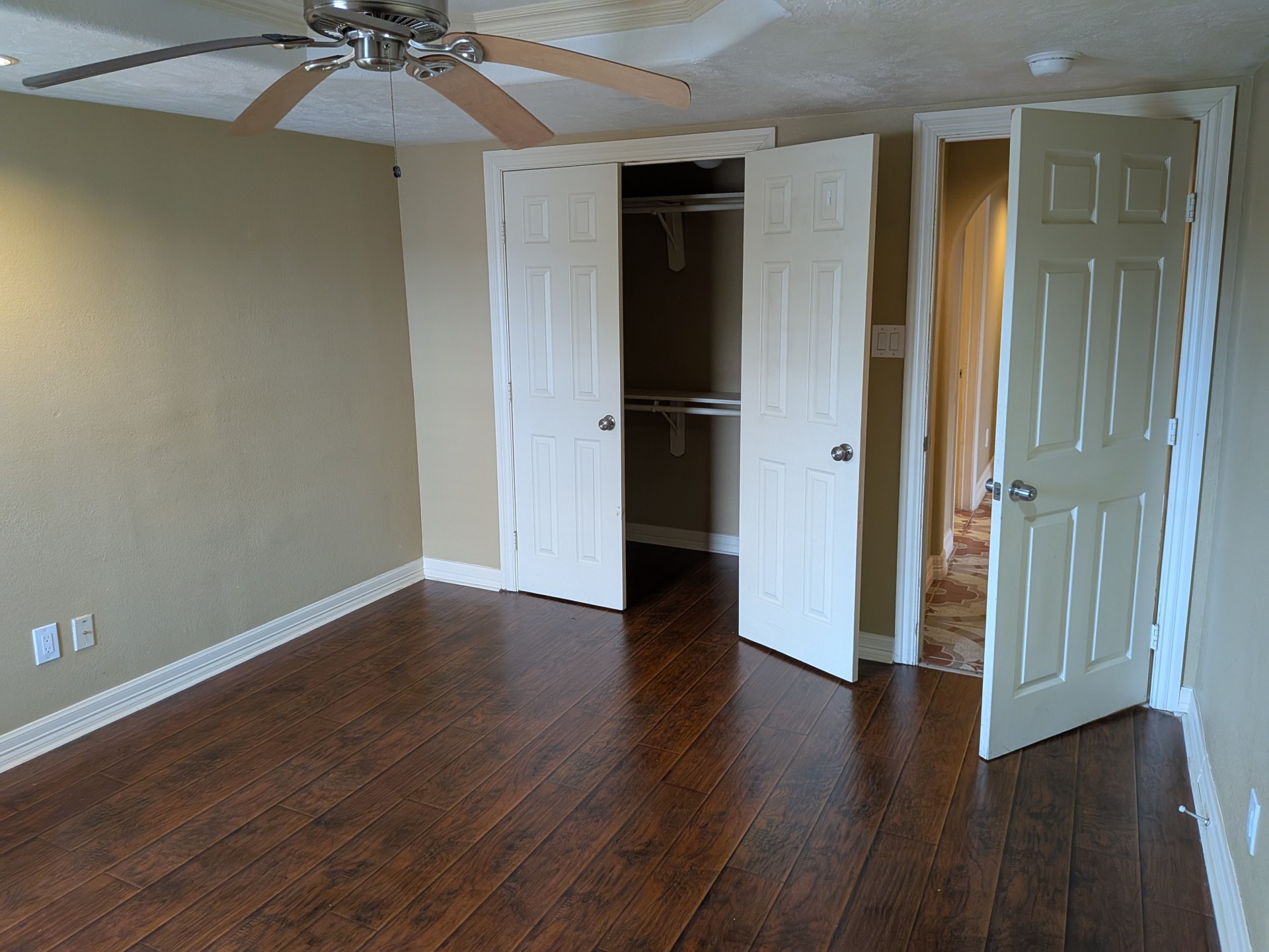 807 Ruth Street Baytown, TX 77520 - Photo 18 of 36 an empty room with wooden floor closet and windows