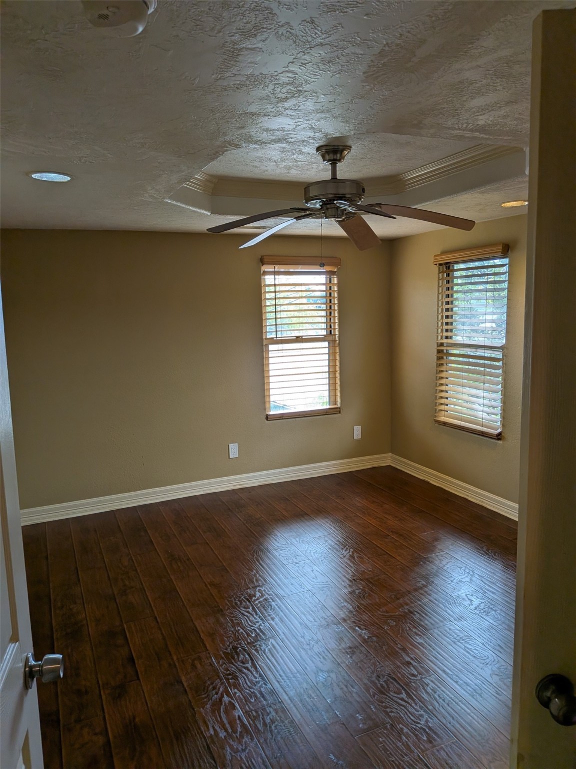 807 Ruth Street Baytown, TX 77520 - Photo 22 of 36 an empty room with wooden floor and windows