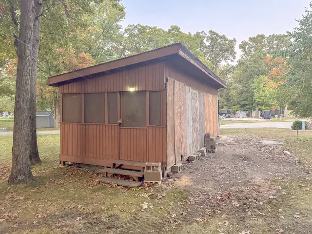 a backyard of a house with wooden fence