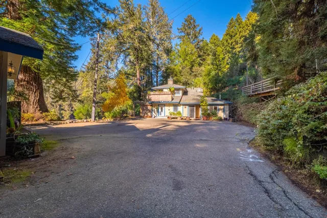 a view of a street with large trees