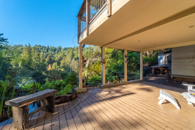 a view of backyard with swimming pool and outdoor seating