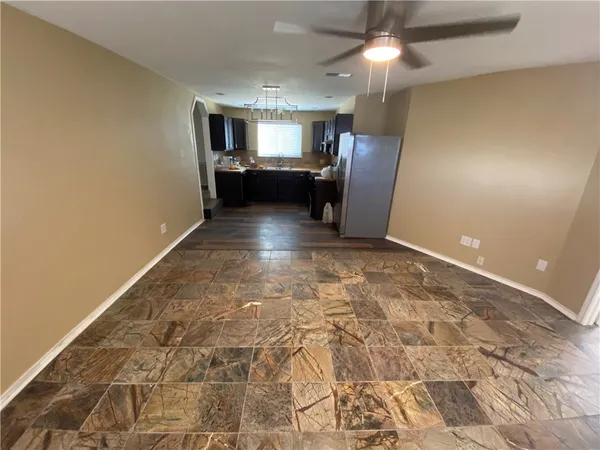 a view of entryway with furniture and wooden floor