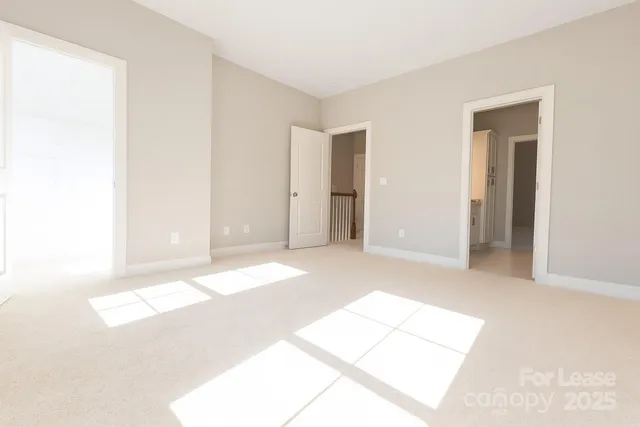 a view of a room with a white walls
