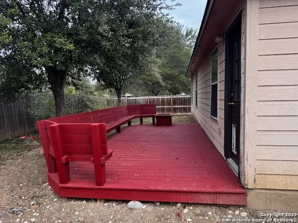 a view of a backyard with sitting area