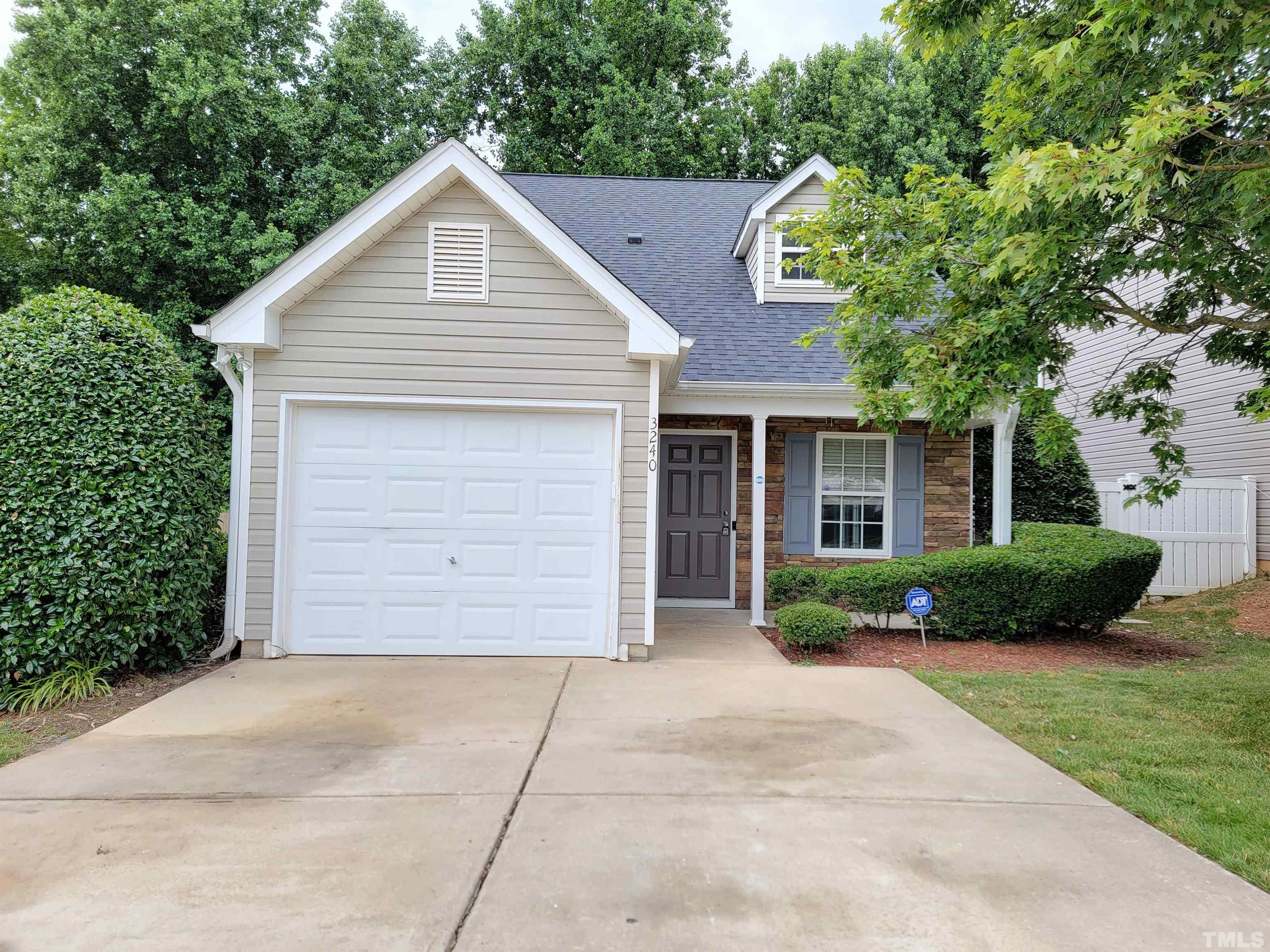 3240 Marcony Way Raleigh, NC 27610 - Photo 1 of 31 a front view of a house with a garden