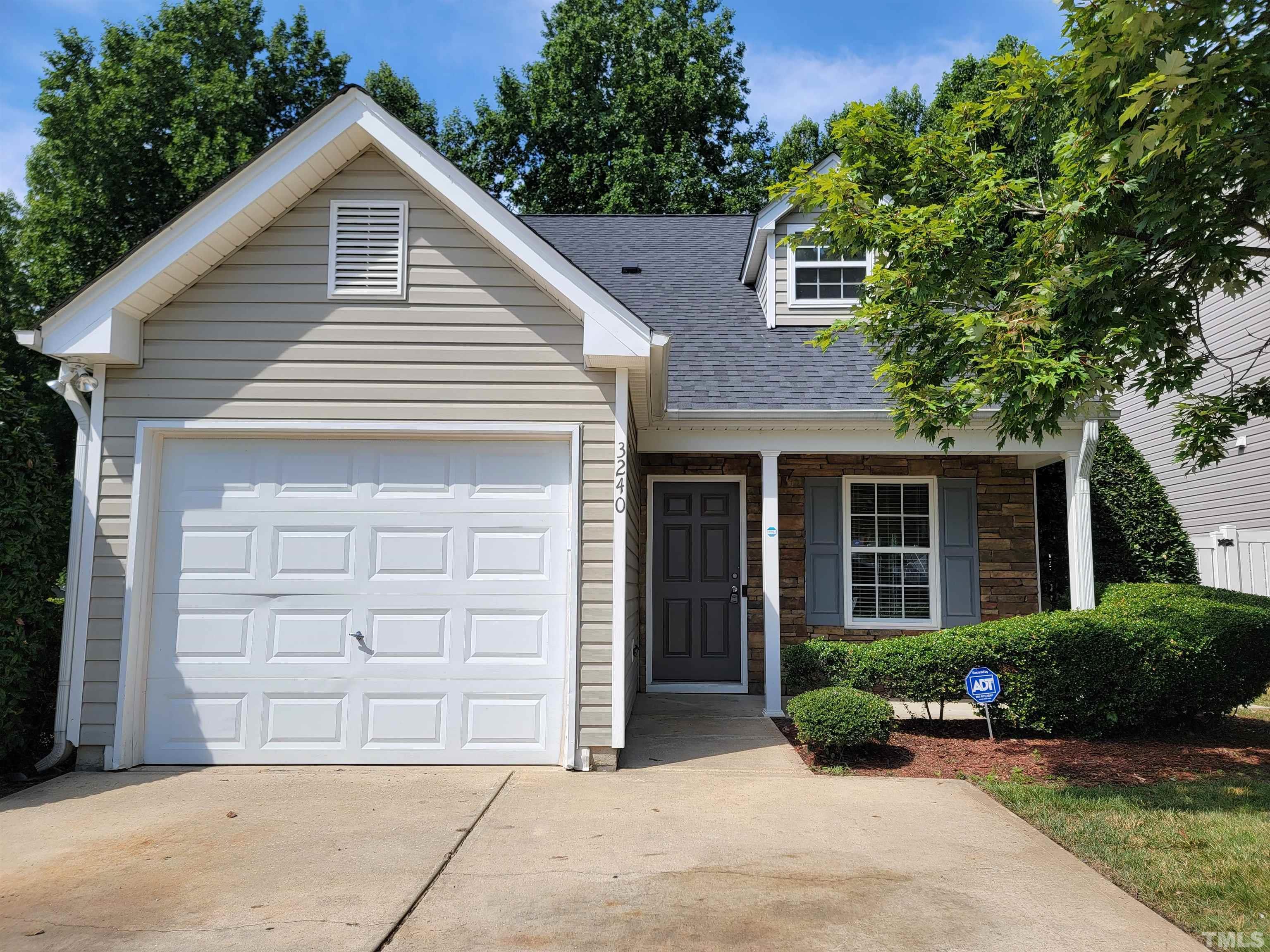 3240 Marcony Way Raleigh, NC 27610 - Photo 13 of 31 a front view of a house with a garden