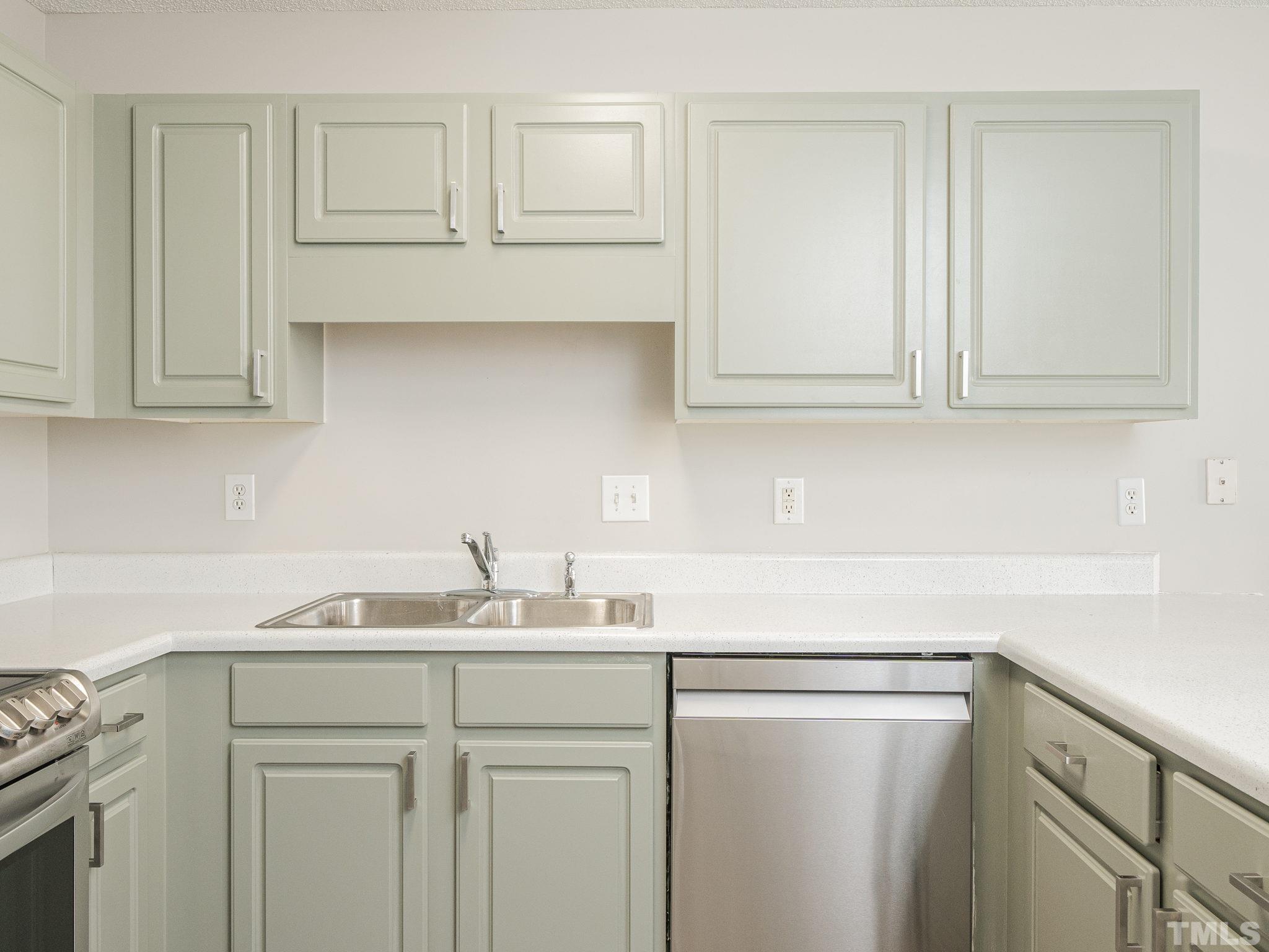 3240 Marcony Way Raleigh, NC 27610 - Photo 17 of 31 a kitchen with a sink and cabinets