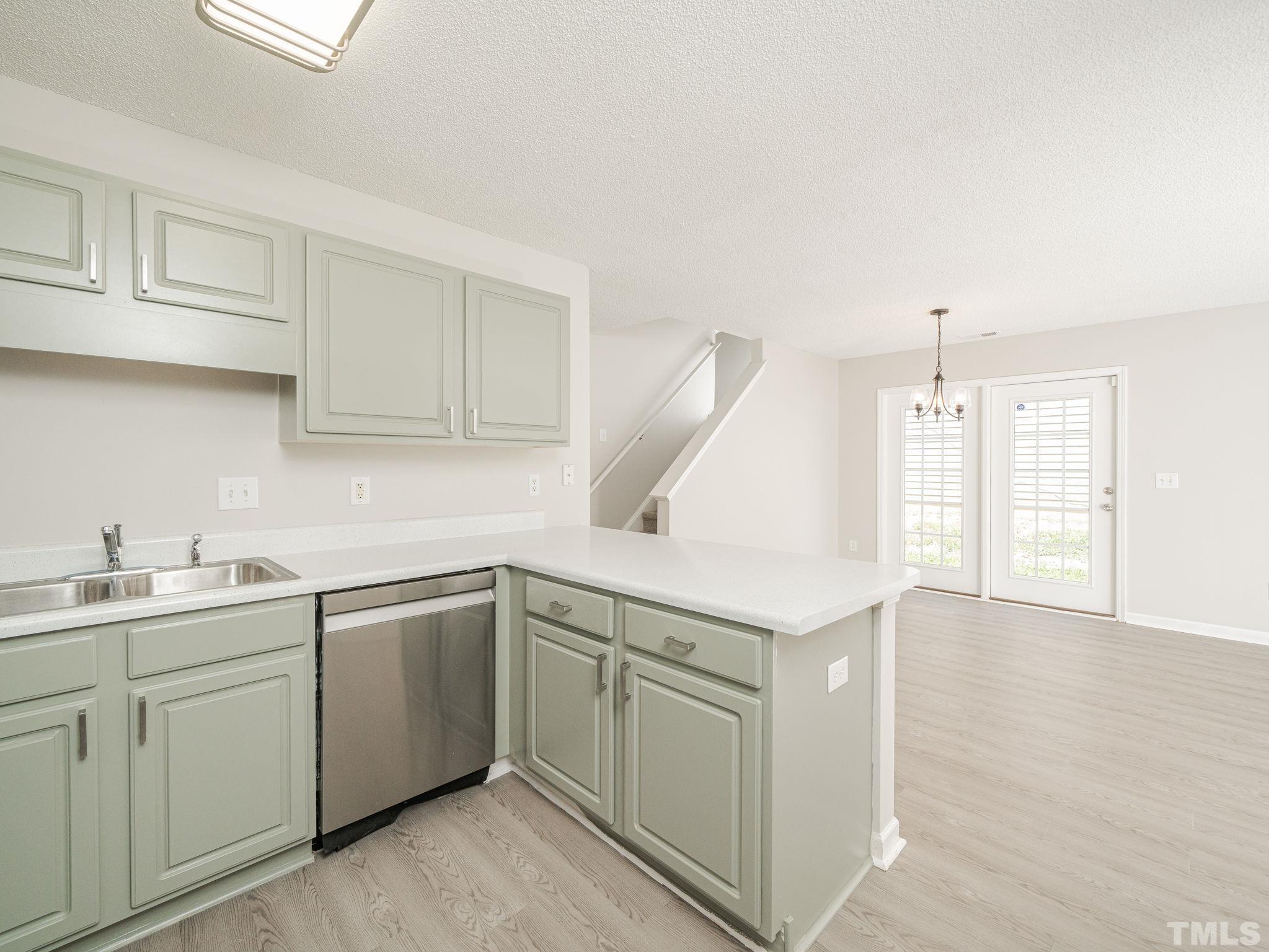 3240 Marcony Way Raleigh, NC 27610 - Photo 18 of 31 a kitchen with a sink and cabinets