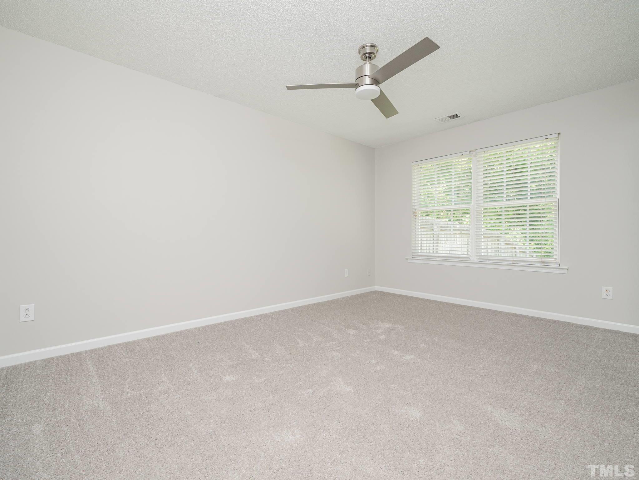 3240 Marcony Way Raleigh, NC 27610 - Photo 20 of 31 an empty room with a window