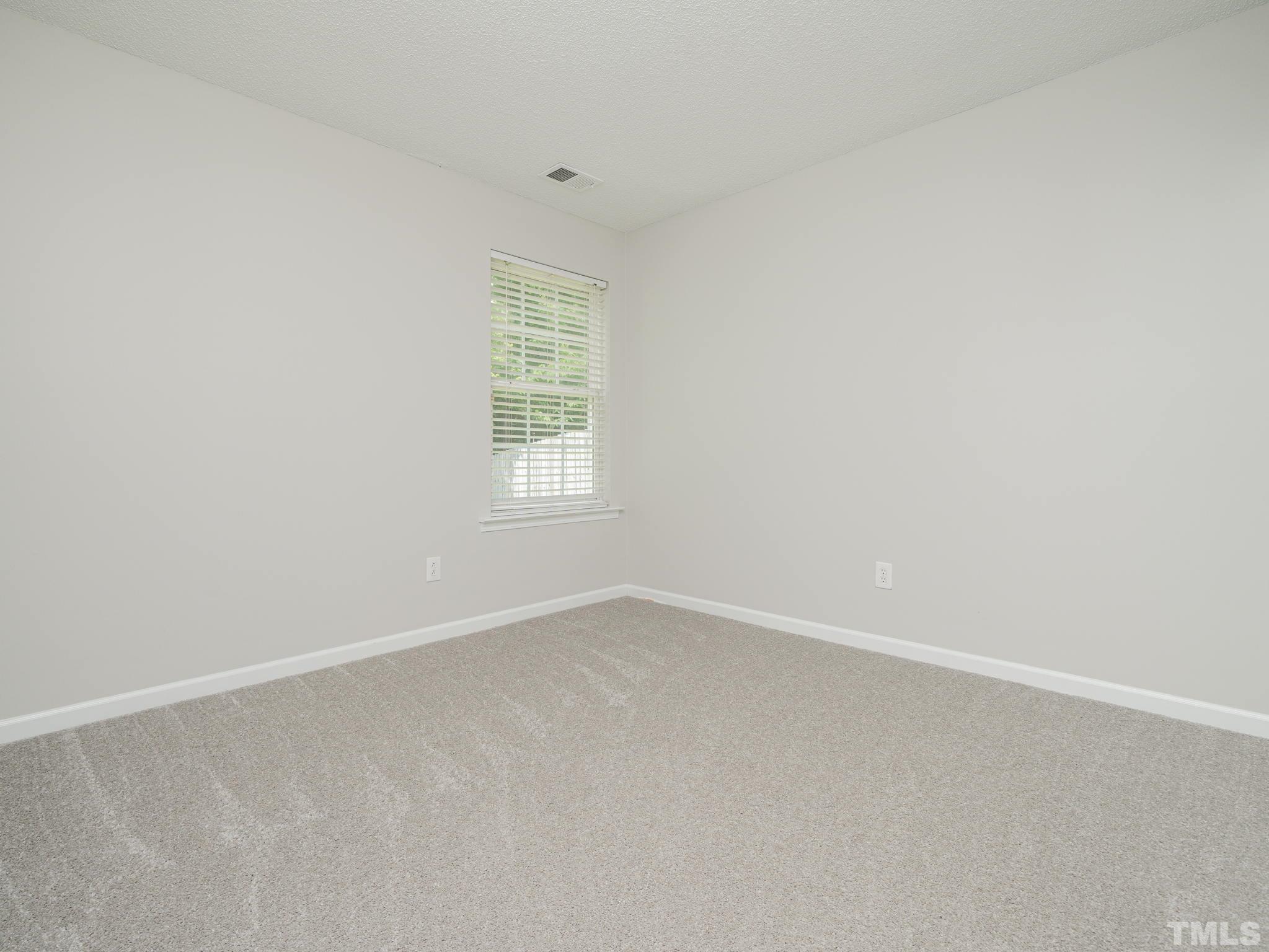 3240 Marcony Way Raleigh, NC 27610 - Photo 21 of 31 an empty room with a window
