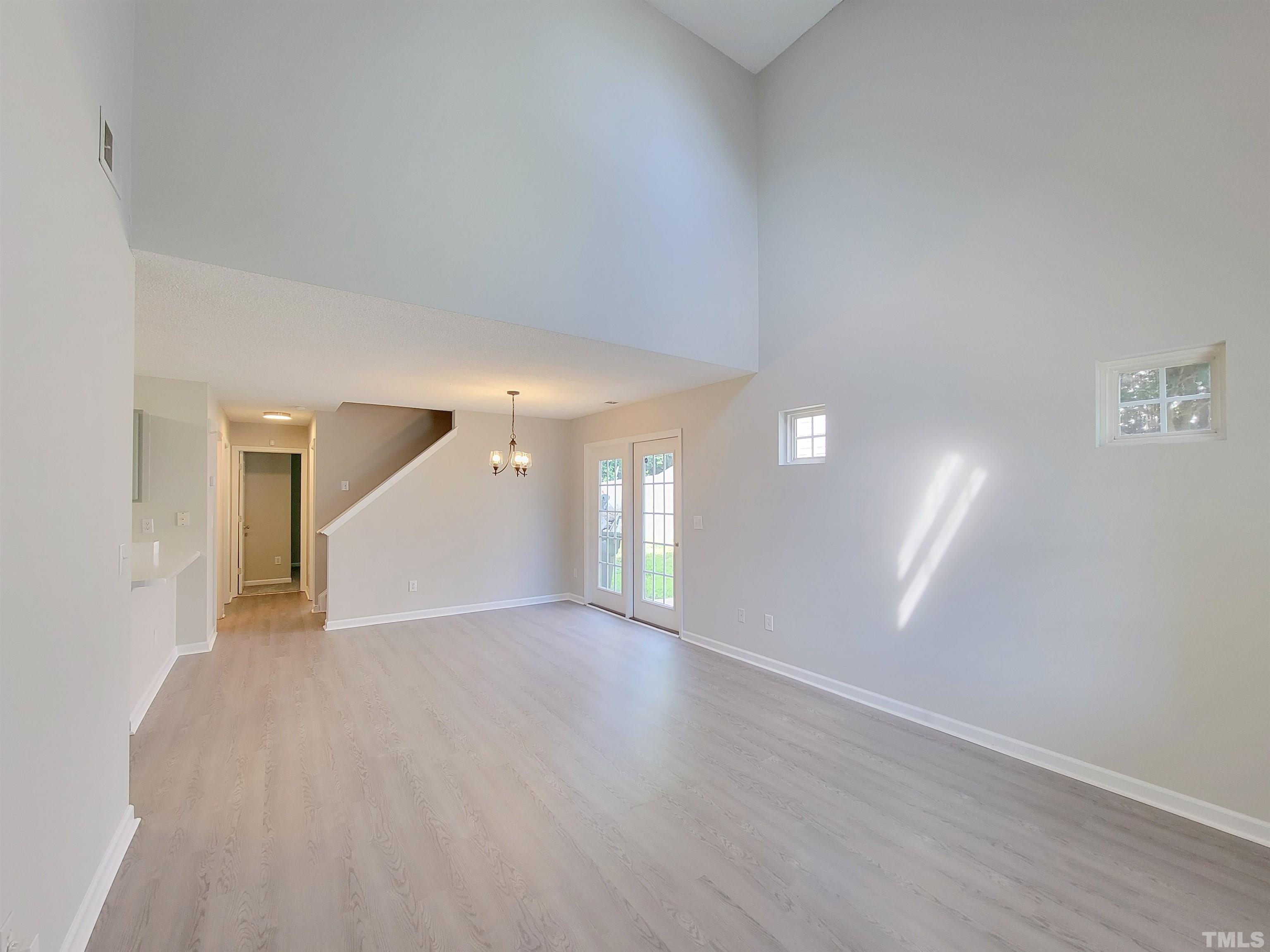 3240 Marcony Way Raleigh, NC 27610 - Photo 5 of 31 a view of an empty room with wooden floor