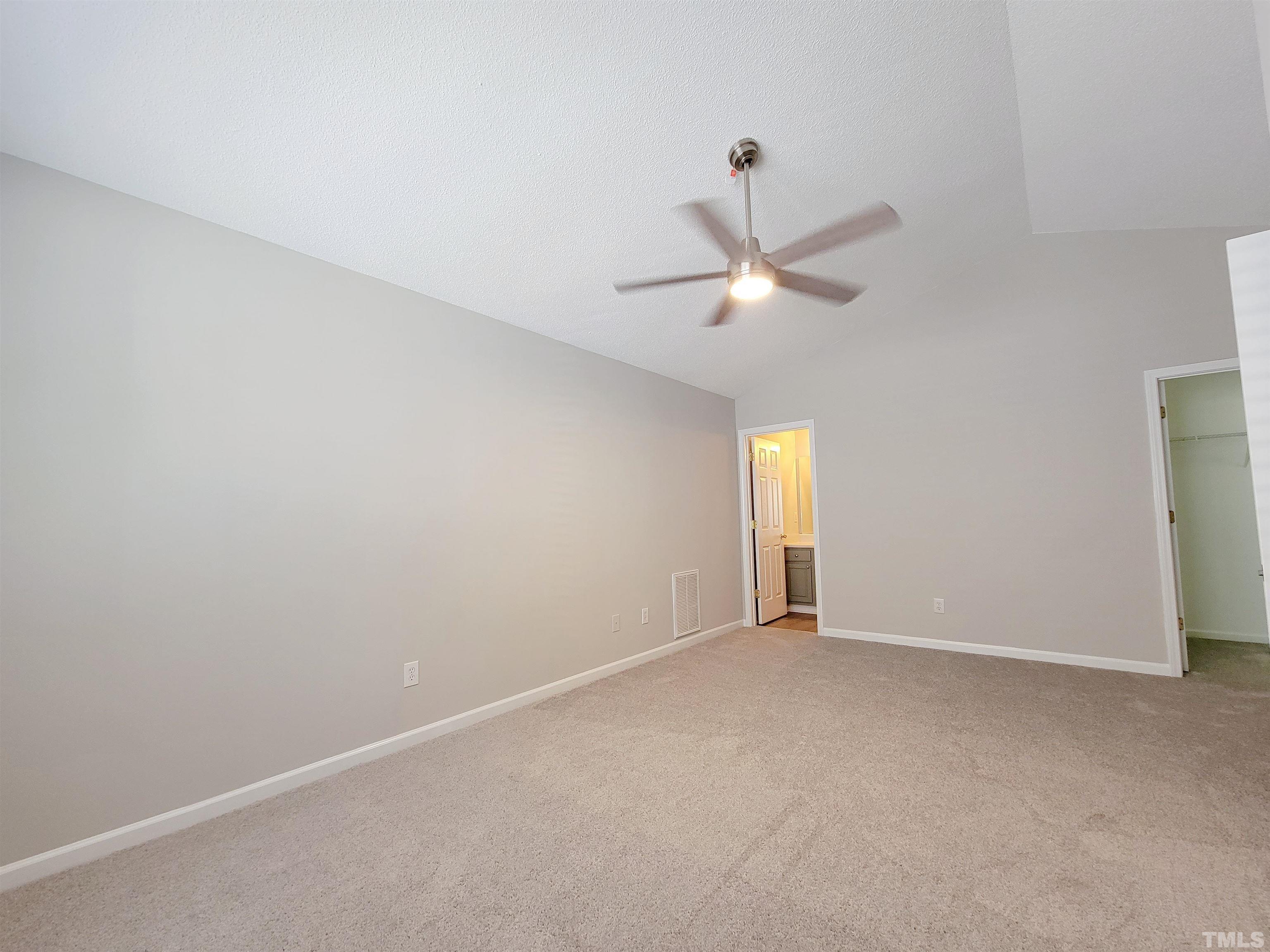 3240 Marcony Way Raleigh, NC 27610 - Photo 8 of 31 an empty room with a window and a ceiling fan