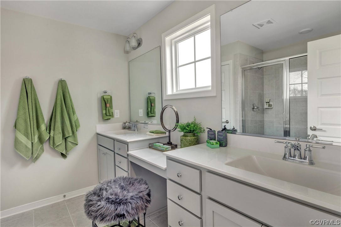 12830 Deep Wl Road Midlothian, VA 23112 - Photo 16 of 50 a bathroom with a sink a mirror and a window