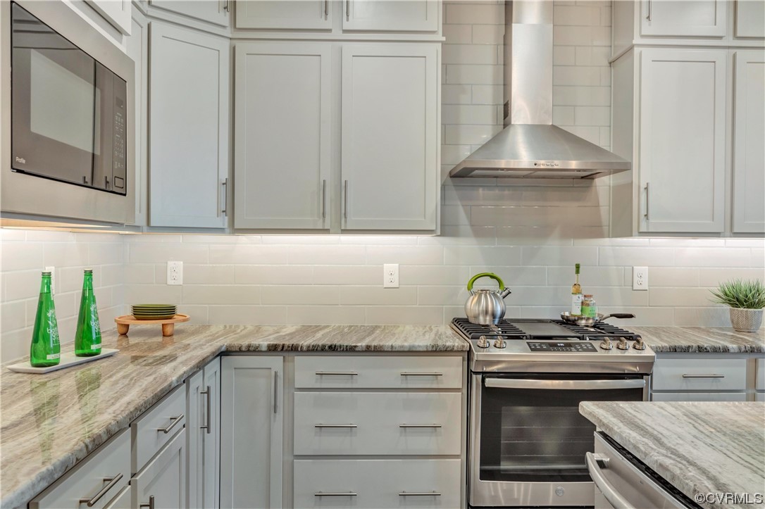 12830 Deep Wl Road Midlothian, VA 23112 - Photo 6 of 50 a kitchen with stainless steel appliances granite countertop a sink and a stove