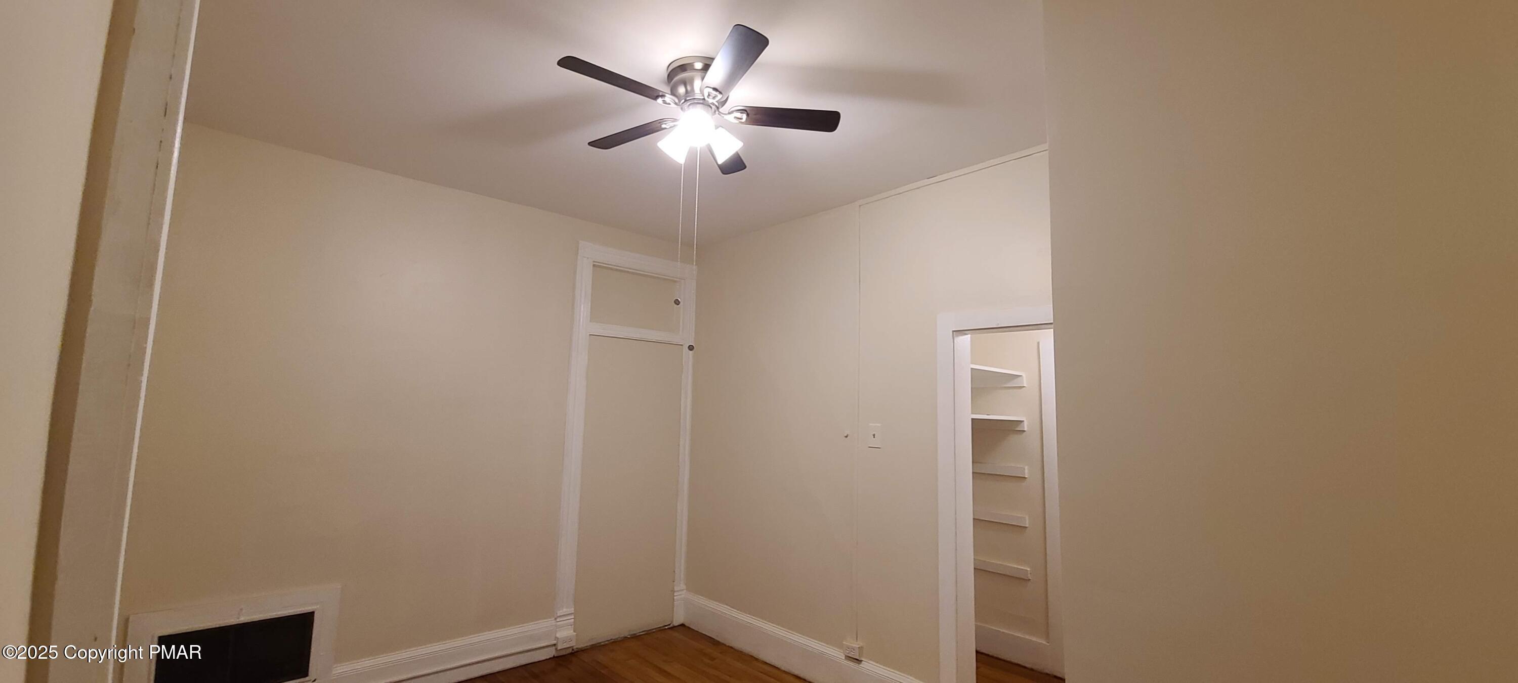 584 Main Street, Unit 1 Stroudsburg, PA 18360 - Photo 14 of 17 an empty room with a window and a fan