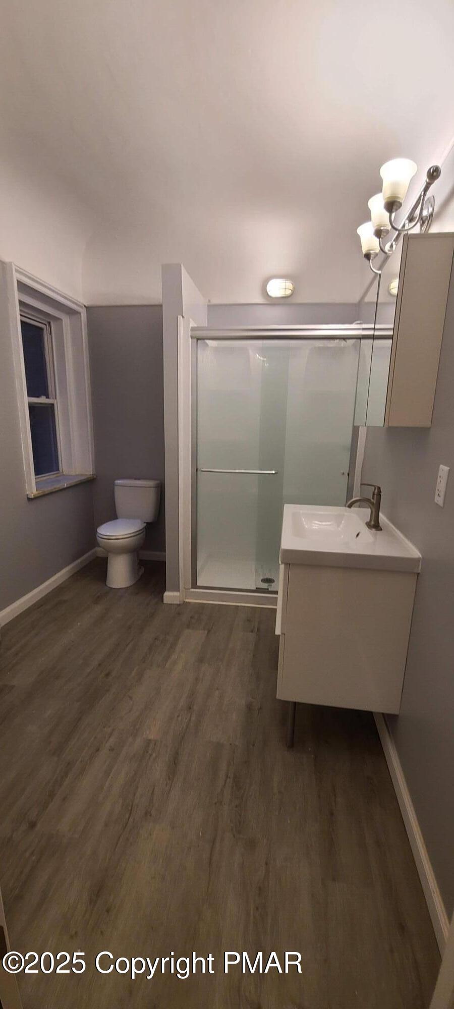 584 Main Street, Unit 1 Stroudsburg, PA 18360 - Photo 15 of 17 a bathroom with a bathtub and a sink