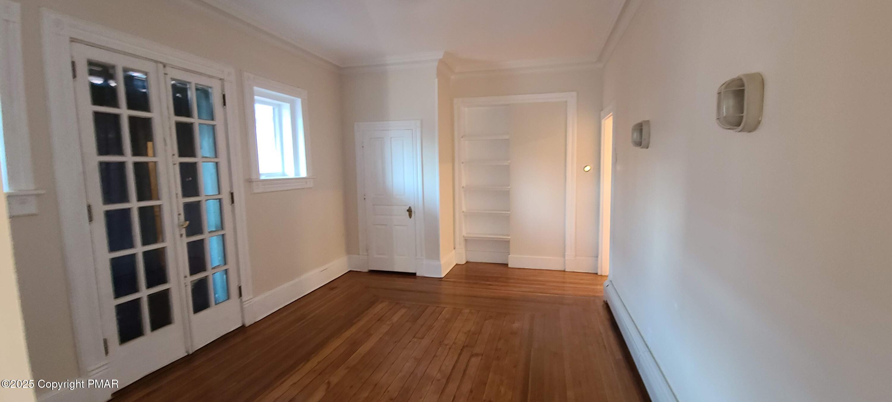 584 Main Street, Unit 1 Stroudsburg, PA 18360 - Photo 7 of 17 wooden floor in a empty room
