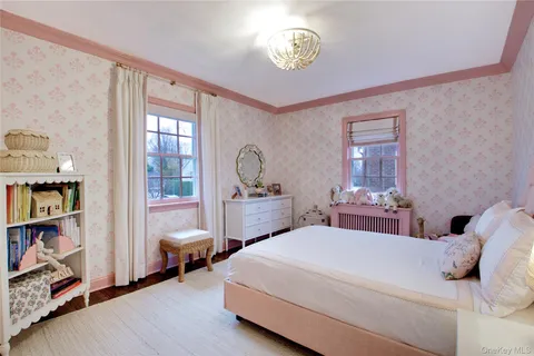 a bedroom with a bed and a book shelf