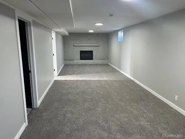 a bathroom with a double vanity sink a toilet and a bathtub