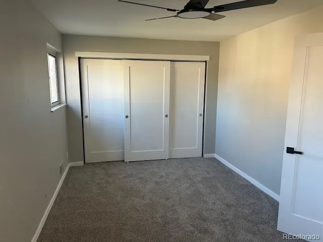 an empty room with a mirror