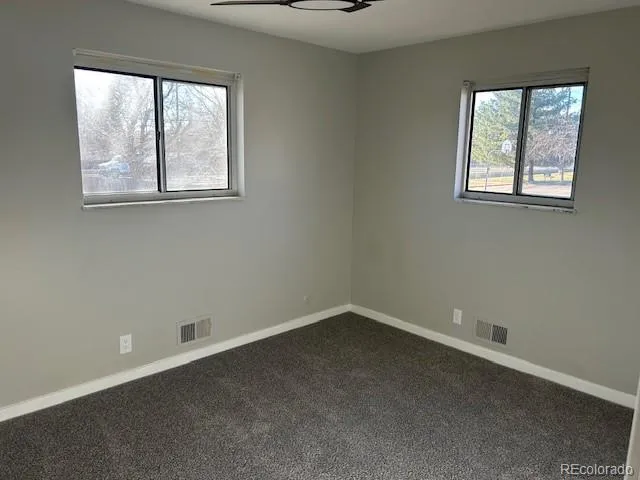 a bathroom with 2 sink and a mirror