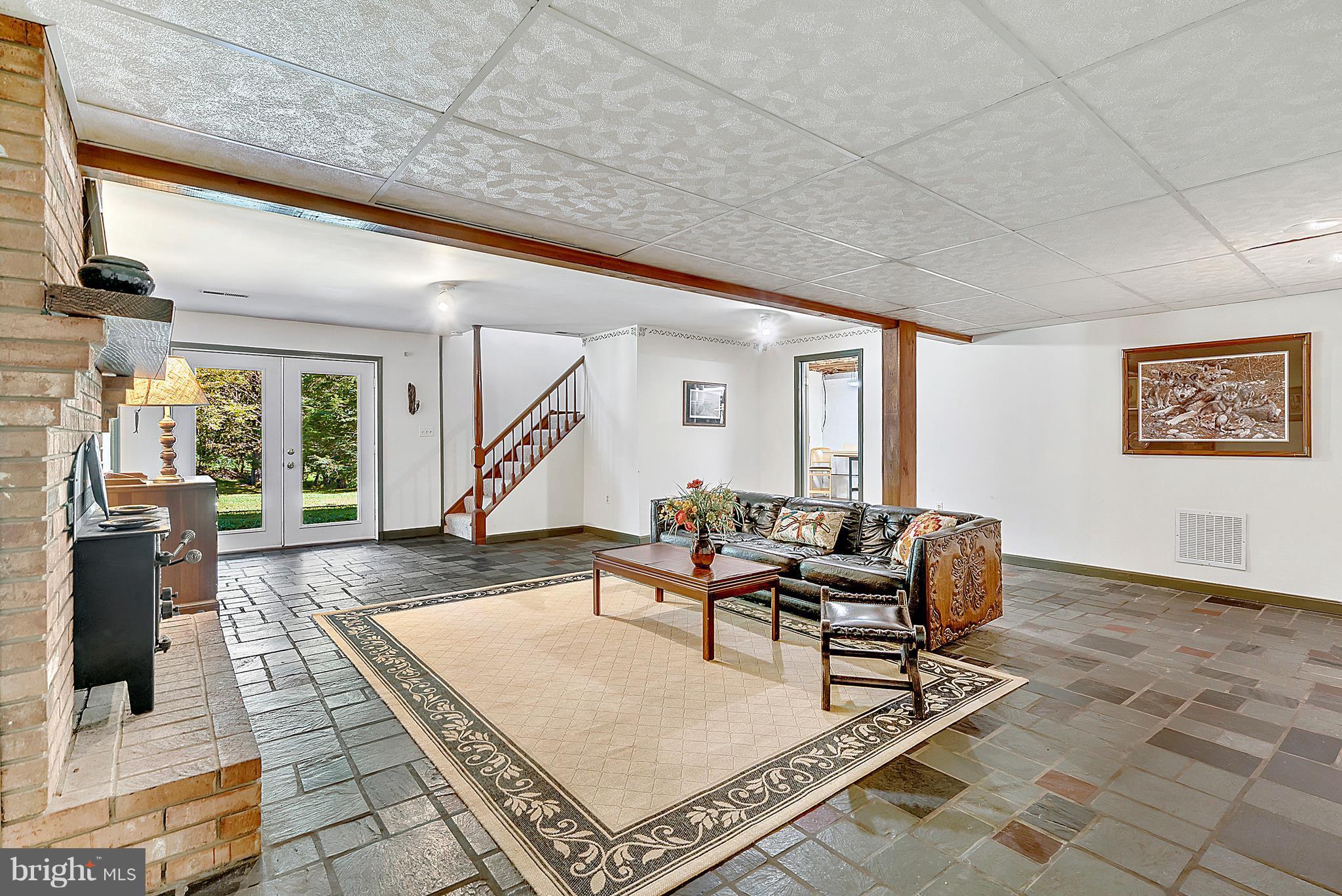 3833 Sage Road Delaplane, VA 20144 - Photo 21 of 30 Cozy Family Room w/ Slate Floors & Wood Stove