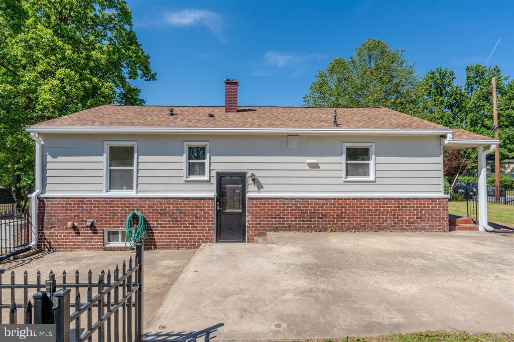 12324 Centerhill Street Silver Spring, MD 20902 - Photo 2 of 24 a front view of a house with a yard